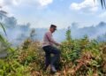 Gerak Cepat Polsek Kurik Padamkan Kebakaran Lahan di Kampung Wonorejo